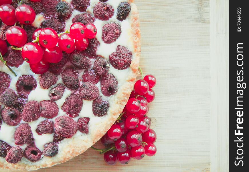 Cake with raspberries topped with fresh red currants. Cake with raspberries topped with fresh red currants