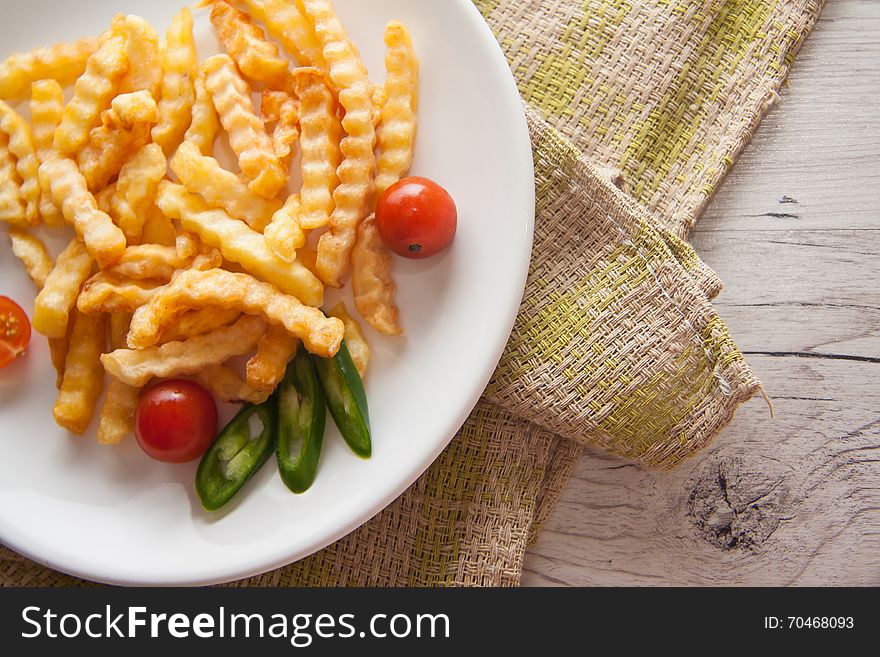 French Fries On Wooden Background