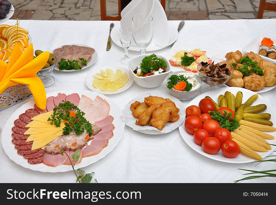 Table served with various dishes. Table served with various dishes