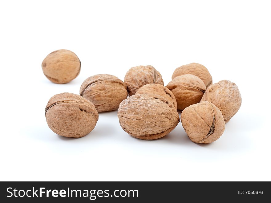 Few walnuts isolated on the white background