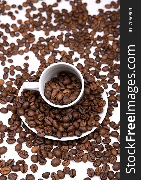 Background with white mug and coffee beans. portrait orientation.
