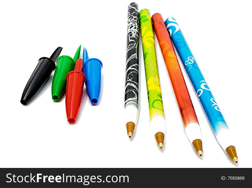 Set of four ballpoints against a white background