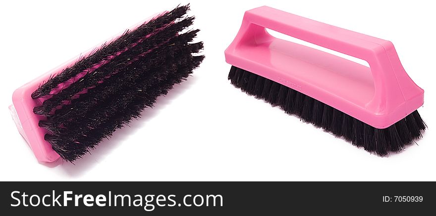 Plastic purple clothes brush isolated on white background. Plastic purple clothes brush isolated on white background