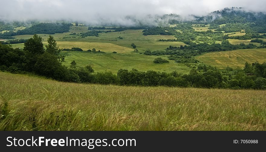 Misty fileds in the heart of Slovakian mountains catched from the train. Misty fileds in the heart of Slovakian mountains catched from the train.