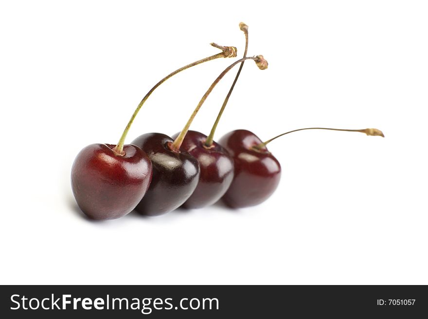 A photo of four fresh cherry