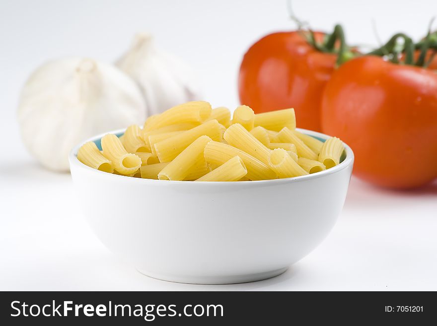 Fresh uncooked raw italian pasta isolated over white