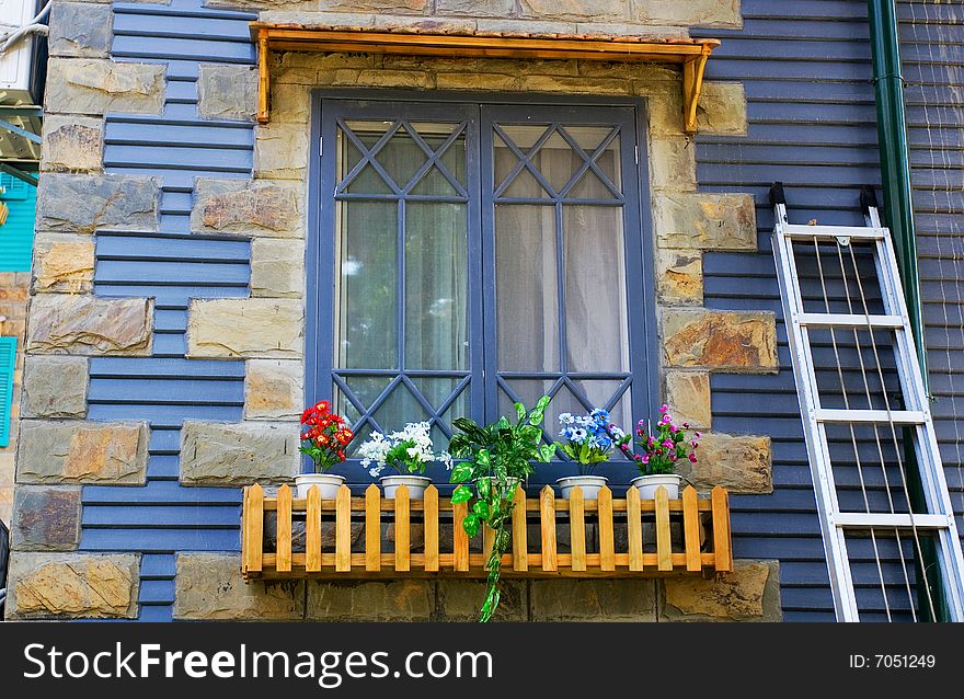 The window of a frame house.