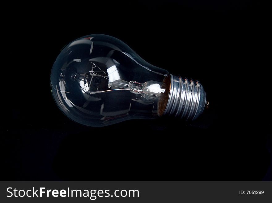 Classic light bulb isolated on black backgound. Classic light bulb isolated on black backgound.