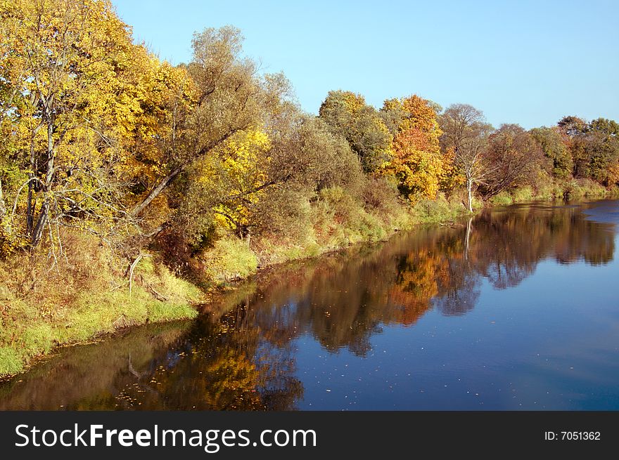 River surrounded by autumn colors. River surrounded by autumn colors