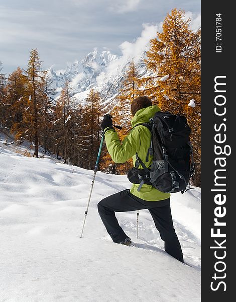 Lonely hiker looking at the wild landscape of Mont Blanc, Italy. Lonely hiker looking at the wild landscape of Mont Blanc, Italy.