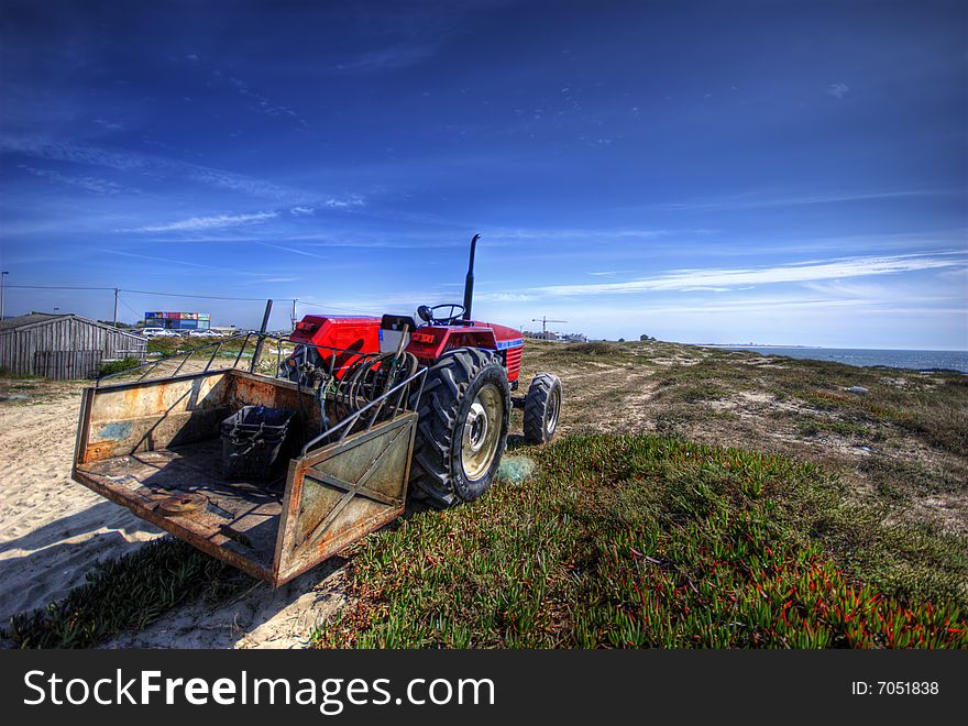 A tractor near a beach.