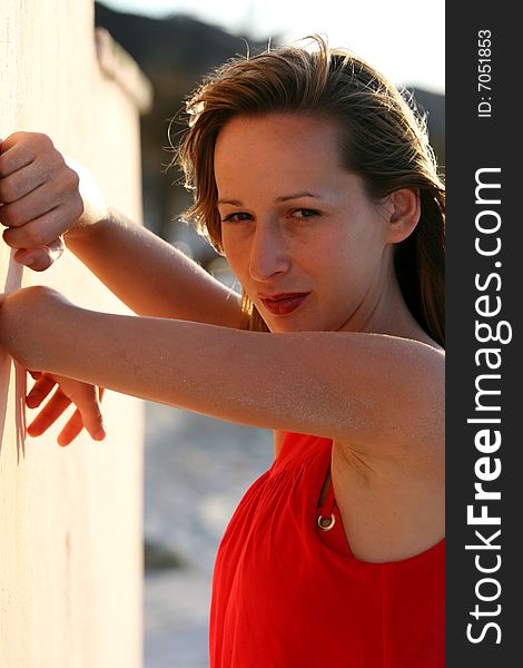 Woman in red dress on the beach. Woman in red dress on the beach