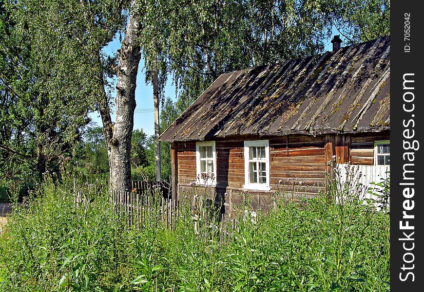 Old wooden farmhouse in village
