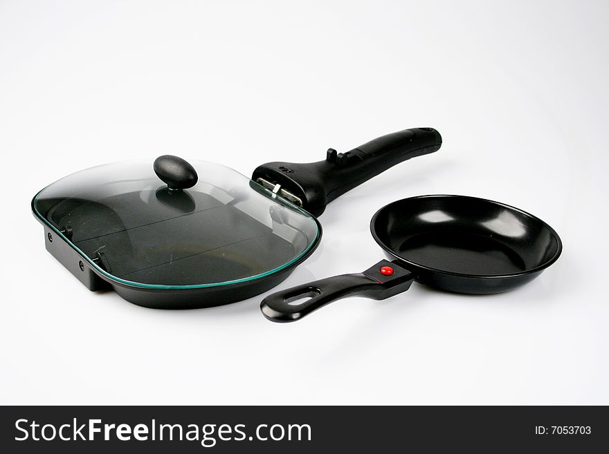 Set of two frying pans isolated from white background