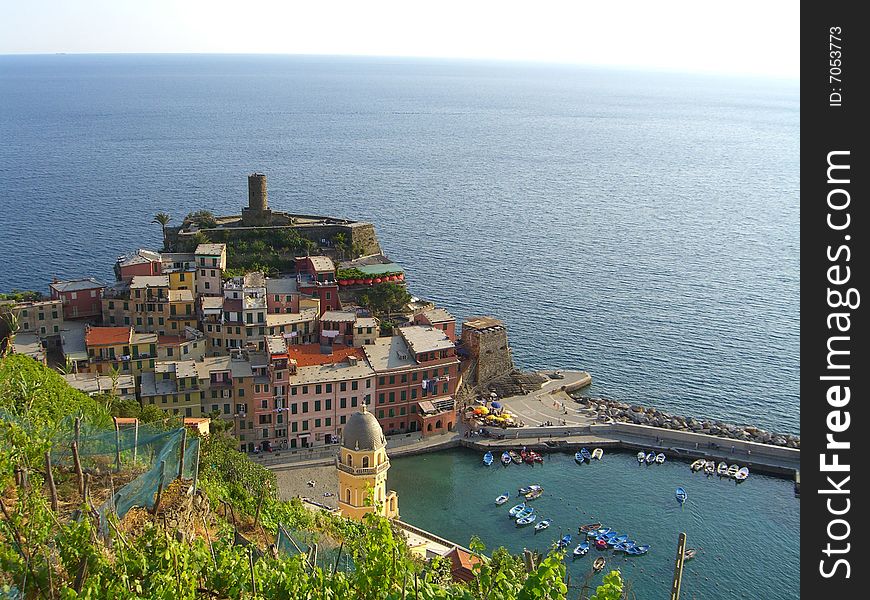 Veranza, Italy. A lovely small harbor is nestled under the shadows of an ancient castle and a dramatic seaside church.