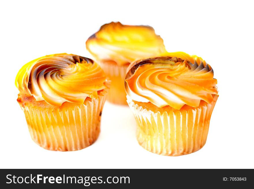 Autumn colored cupcakes isolated on white. Autumn colored cupcakes isolated on white.