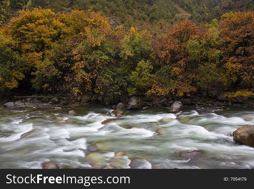 River flows in autumn in the southwest of china. River flows in autumn in the southwest of china