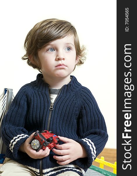 Portrait of little boy dreaming. Shallow DOF.