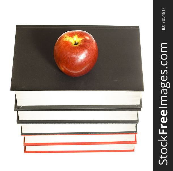 Apple and books isolated on white