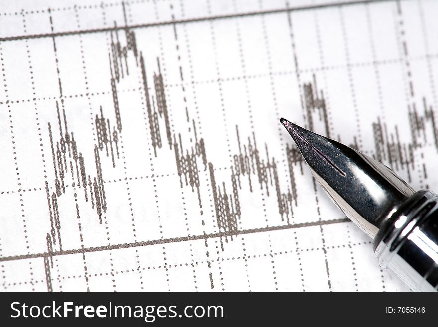 Stock photo: silver pen and financial report. Stock photo: silver pen and financial report