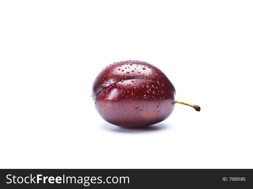 One plum on a white background, isolation