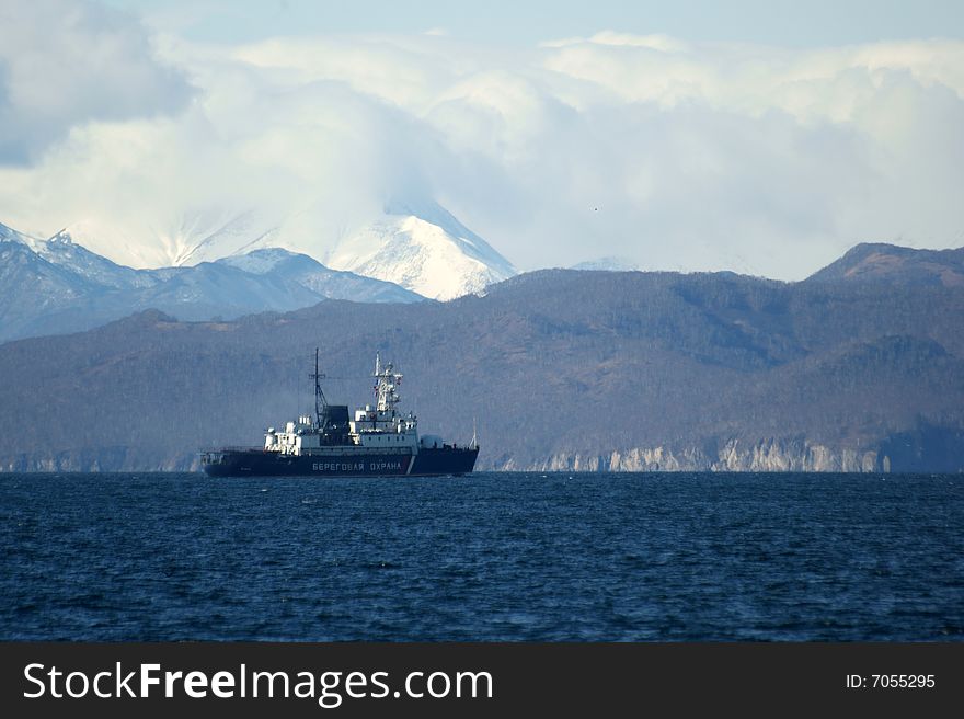 Warship coast guard on background of the mountains. Warship coast guard on background of the mountains