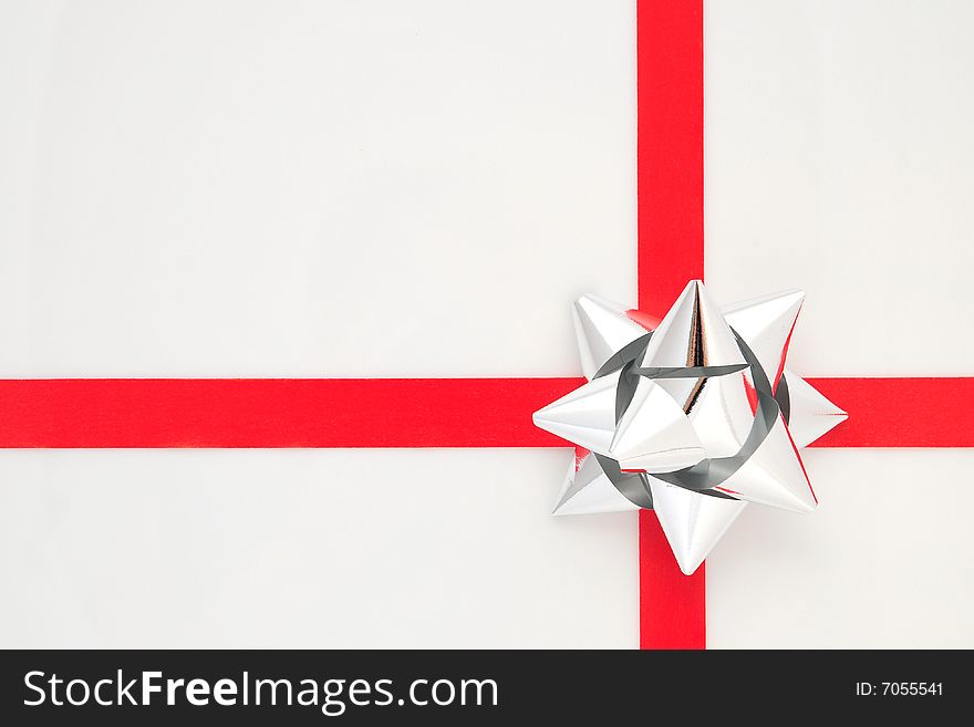 Silver And Red Bow Isolated On White Background