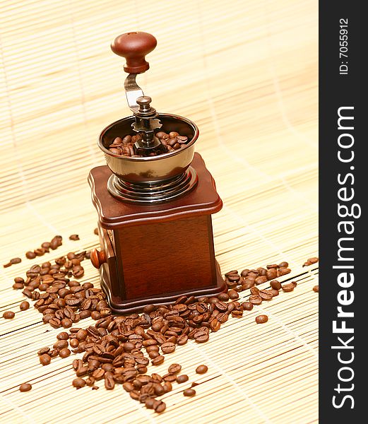 Coffee grinder against coffee grains