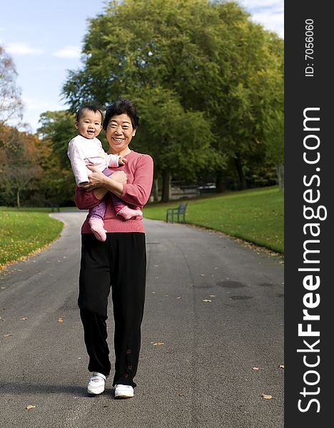 Grandmother and granddaughter in park