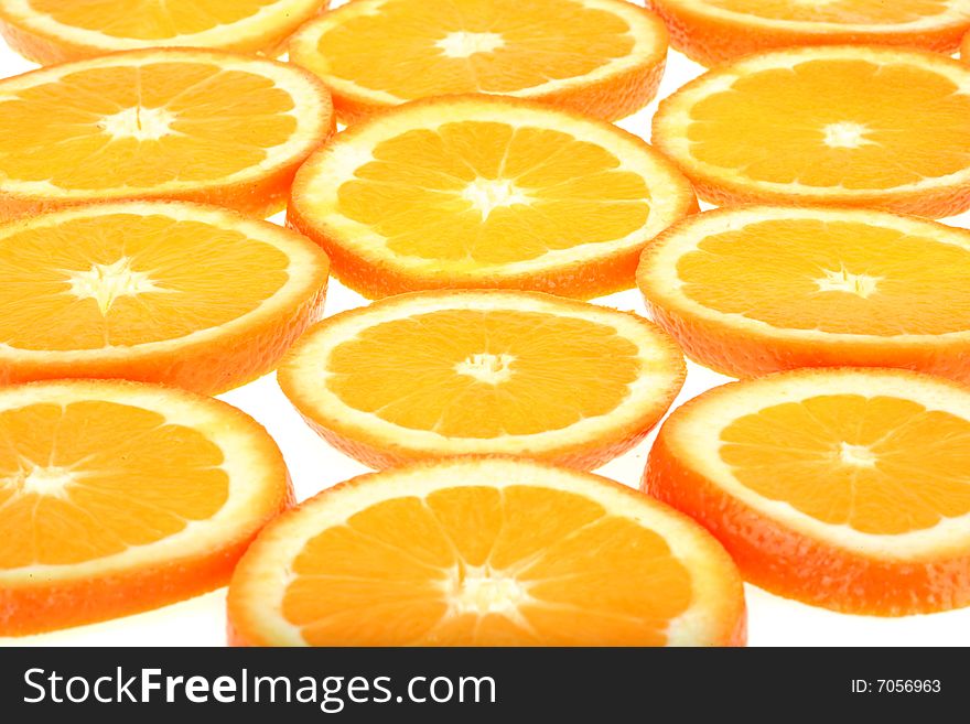 Background of juicy fresh sliced oranges on white. Background of juicy fresh sliced oranges on white