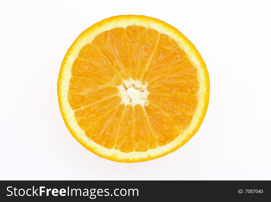 A perfectly round orange slice isolated on a white background. A perfectly round orange slice isolated on a white background