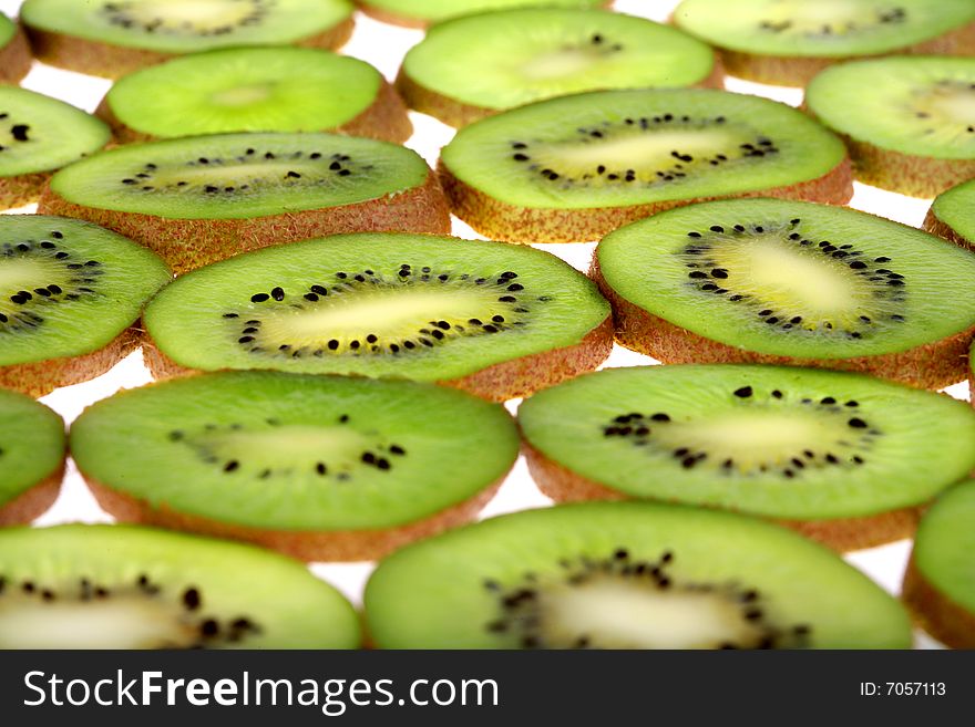Background of juicy fresh sliced kiwi on white. Background of juicy fresh sliced kiwi on white