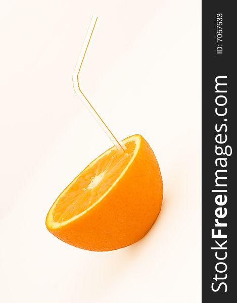 Close-up of orange with a straw. Close-up of orange with a straw