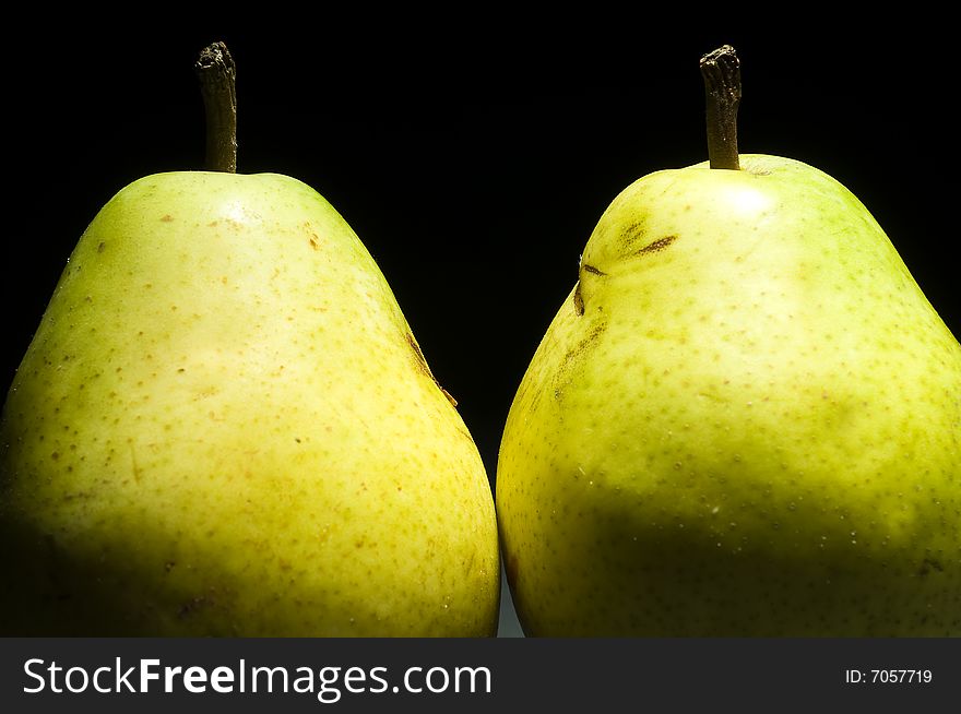 Two pears isolated on black background. Two pears isolated on black background