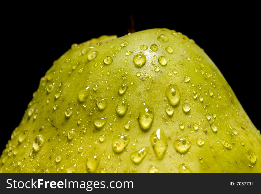 Close up of a fresh pear isolated on black. Close up of a fresh pear isolated on black
