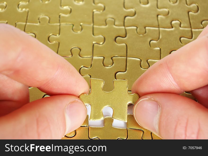 Hands holding a puzzle piece . business concepts. Hands holding a puzzle piece . business concepts