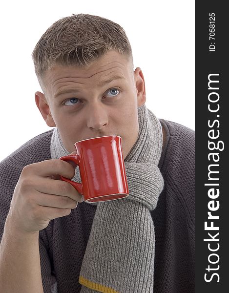 Handsome man drinking coffee on an isolated white background