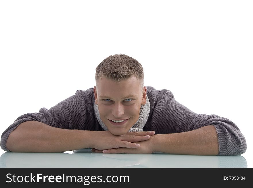 Laying handsome male looking at camera on an isolated white background