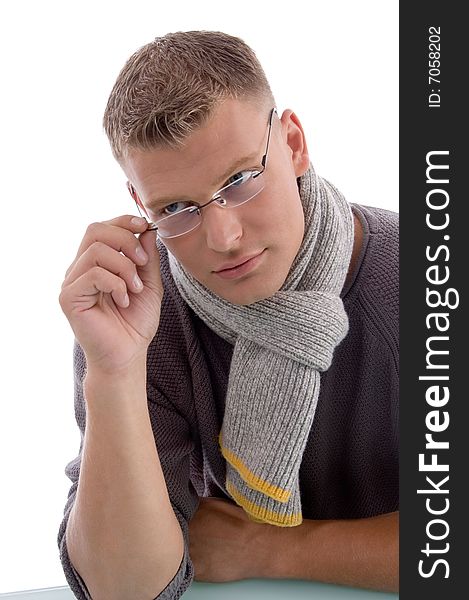 Young male holding eyewear on an isolated white background