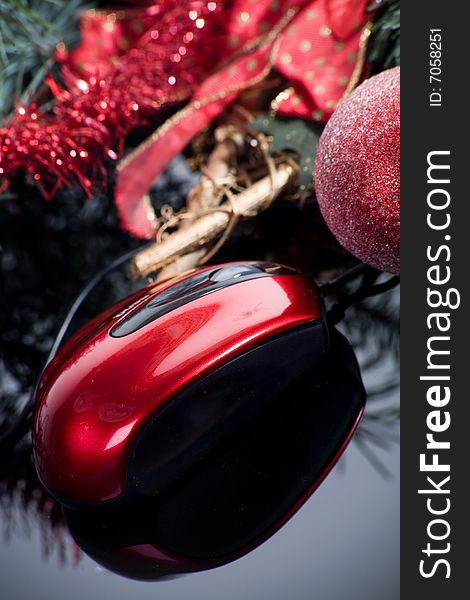 Red ball Christmas decoration on dark background with computer mouse gift. Red ball Christmas decoration on dark background with computer mouse gift