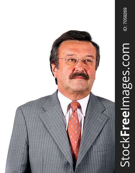 A businessman in his sixties with glasses a suit and a mustache. Isolated over white. A businessman in his sixties with glasses a suit and a mustache. Isolated over white.
