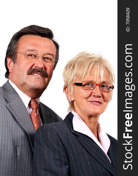 A senior business couple in suits in their 50s and 60s. Isolated over white. A senior business couple in suits in their 50s and 60s. Isolated over white.