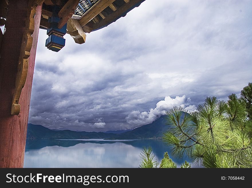 This is a picture of beautiful lake and chinese historic building. This is a picture of beautiful lake and chinese historic building