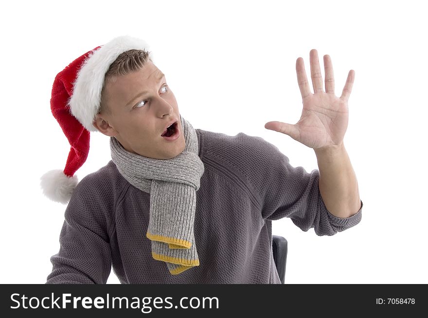 Smiling young man with christmas hat showing five fingers on an isolated white background