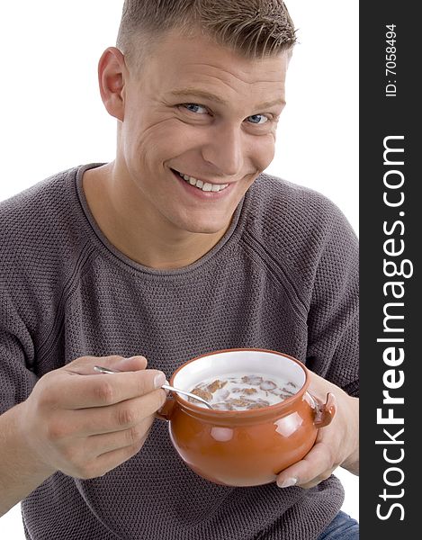 Portrait of smiling male going to eat cornflakes with white background