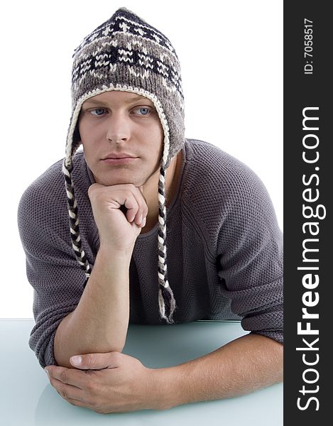 Adult man wearing winter cap on an isolated background