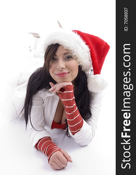 Beautiful woman lying on the floor and wearing christmas hat on an isolated background