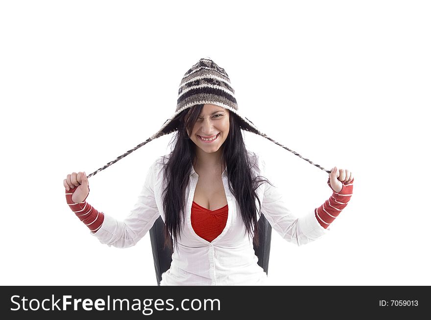 Pretty girl stretching her cap on an isolated white background