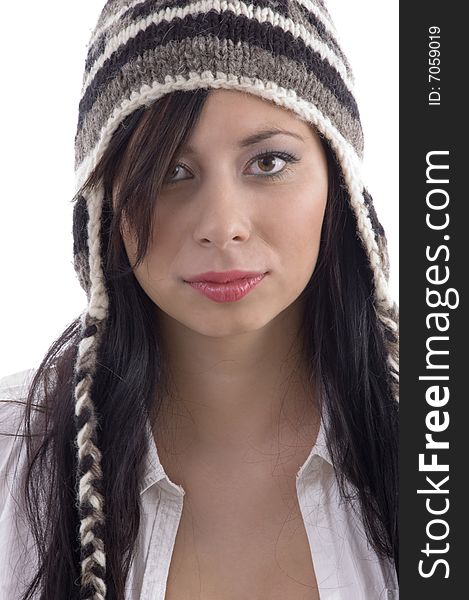 Beautiful woman wearing woolen cap on an isolated white background