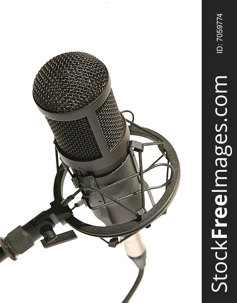 Black studio microphone isolated on the white background
